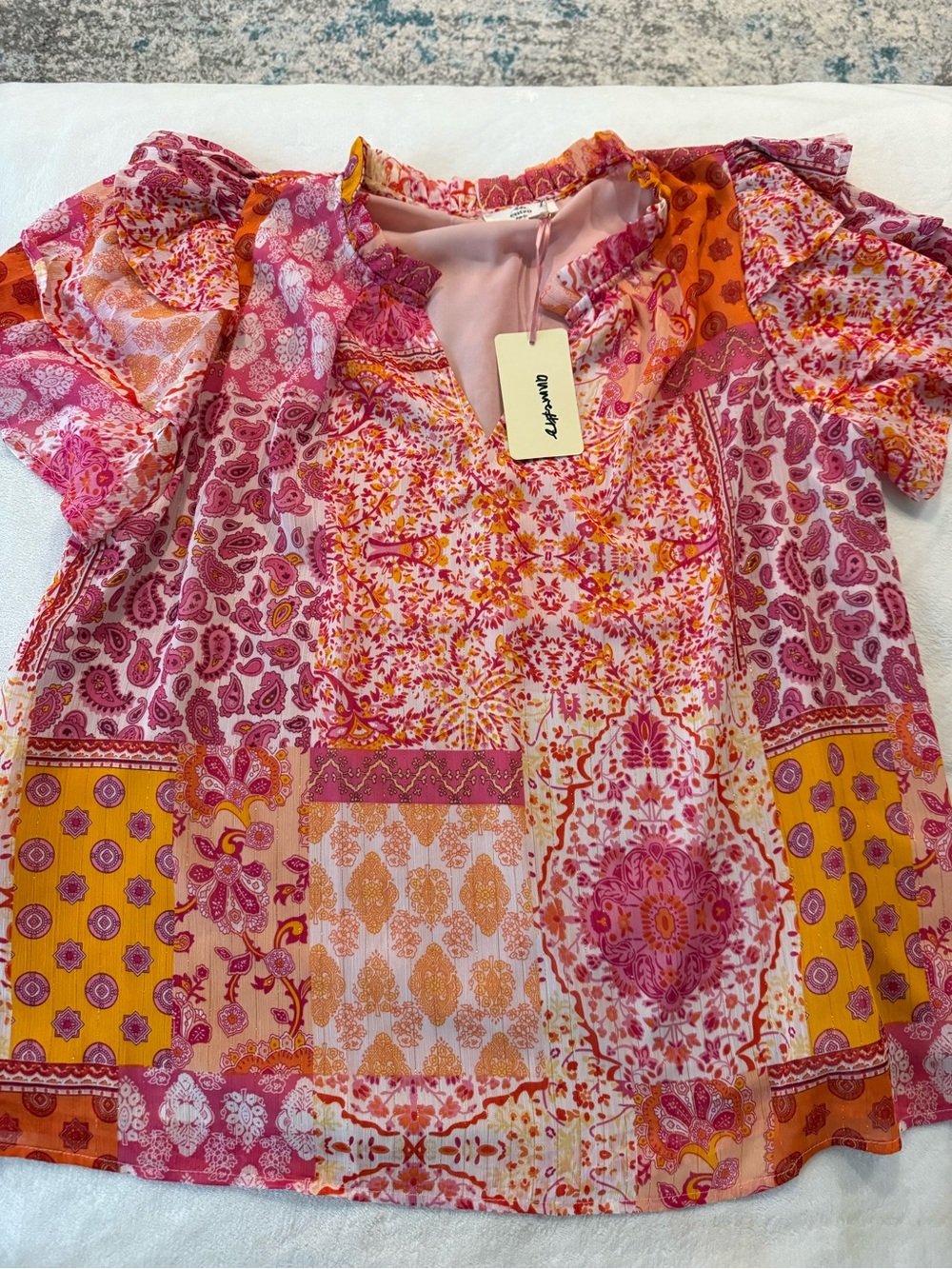 Entro floral patchwork blouse featuring a pink, orange, yellow paisley L E01